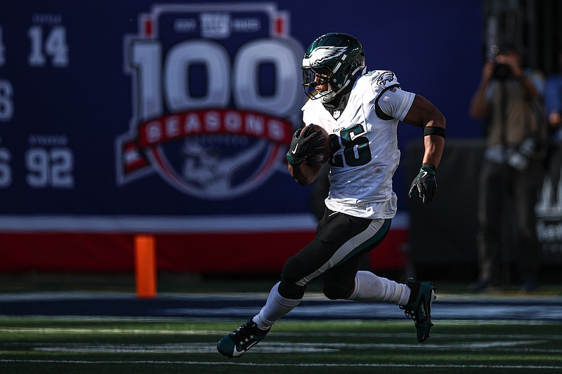 Oct 20, 2024; East Rutherford, New Jersey, USA; Philadelphia Eagles running back Saquon Barkley (26) carries the ball during the second half against the New York Giants at MetLife Stadium. Mandatory Credit: Vincent Carchietta-Imagn Images