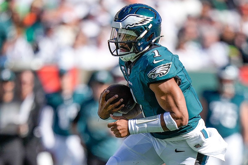 Philadelphia Eagles quarterback Jalen Hurts (1) runs for a first down in the second quarter of the NFL Week 8 game between the Cincinnati Bengals and the Philadelphia Eagles at Paycor Stadium in downtown Cincinnati on Sunday, Oct. 27, 2024.