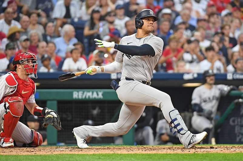 Jul 29, 2024; Philadelphia, Pennsylvania, USA;  New York Yankees outfielder Juan Soto (22) hits a two RBI double against the Philadelphia Phillies during the fifth inning at Citizens Bank Park. Mandatory Credit: Eric Hartline-USA TODAY Sports