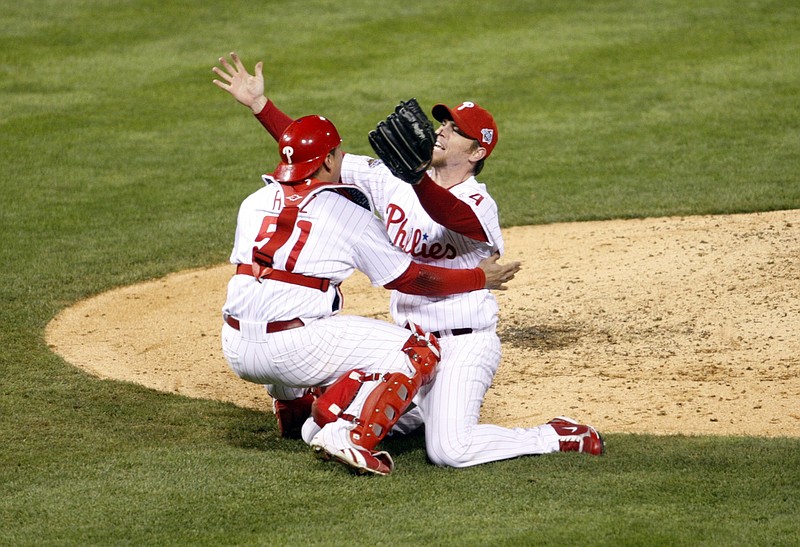 Oct 29, 2008; Philadelphia, PA, USA; Philadelphia Phillies relief pitcher Brad Lidge (54) celebrates with catcher Carlos Ruiz (51) after defeating the Tampa Bay Rays 4-3 in game five of the World Series at Citizens Bank Park to win the series, four games to one. Mandatory Credit: Howard Smith-USA TODAY Sports