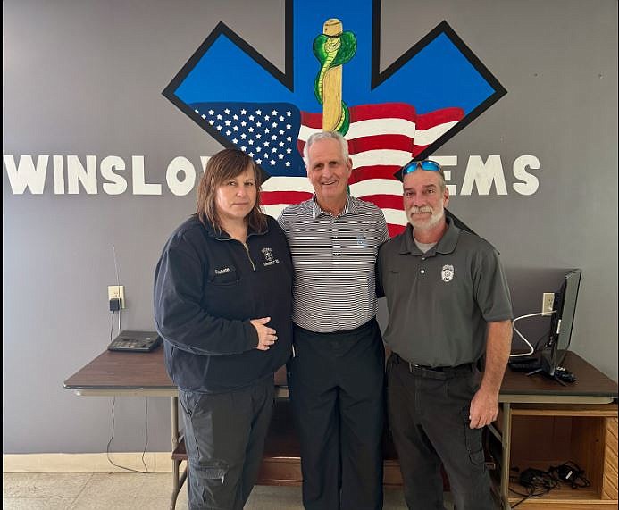 Ronald Kollman Sr., center, with Sandy Mallette and Kyle Osiecki.