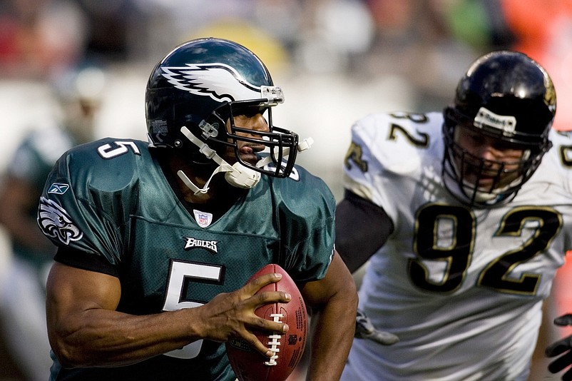 Oct 29, 2006; Philadelphia, PA, USA; Philadelphia Eagles quarterback (5) Donovan McNabb is chased by Jacksonville Jaguars defensive end (92) Rob Meier during the second quarter at Lincoln Financial Field in Philadelphia, PA. Mandatory Credit: Howard Smith-USA TODAY Sports Copyright © 2006 Howard Smith