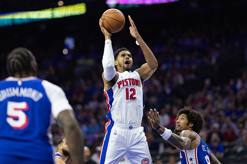 Oct 30, 2024; Philadelphia, Pennsylvania, USA; Detroit Pistons forward Tobias Harris (12) shoots in front of Philadelphia 76ers guard Kelly Oubre Jr. (9) during the first quarter at Wells Fargo Center. Mandatory Credit: Bill Streicher-Imagn Images