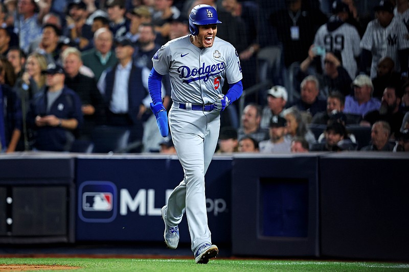 Oct 30, 2024; New York, New York, USA; Los Angeles Dodgers first baseman Freddie Freeman (5) celebrates after scoring a run during the fifth inning against the New York Yankees in game four of the 2024 MLB World Series at Yankee Stadium. Mandatory Credit: Brad Penner-Imagn Images