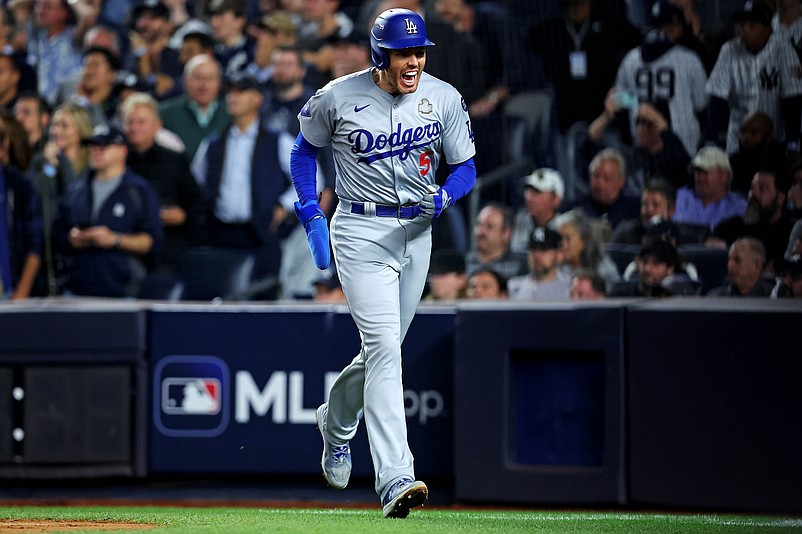 Oct 30, 2024; New York, New York, USA; Los Angeles Dodgers first baseman Freddie Freeman (5) celebrates after scoring a run during the fifth inning against the New York Yankees in game four of the 2024 MLB World Series at Yankee Stadium. Mandatory Credit: Brad Penner-Imagn Images