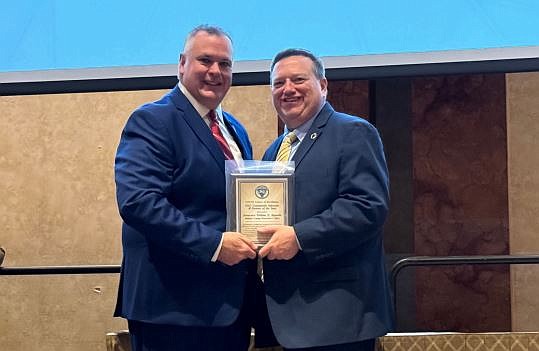 Atlantic County Prosecutor Will Reynolds, left, is presented the award by Crisis Intervention Team New Jersey Chairman Ed Dobleman