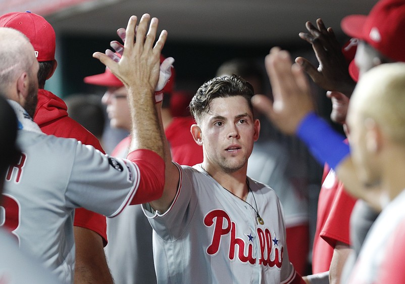 Sep 3, 2019; Cincinnati, OH, USA; Philadelphia Phillies shortstop Scott Kingery (4) is congratulated in the dugout after hitting a solo home run against the Cincinnati Reds during the ninth inning at Great American Ball Park. Mandatory Credit: David Kohl-USA TODAY Sports