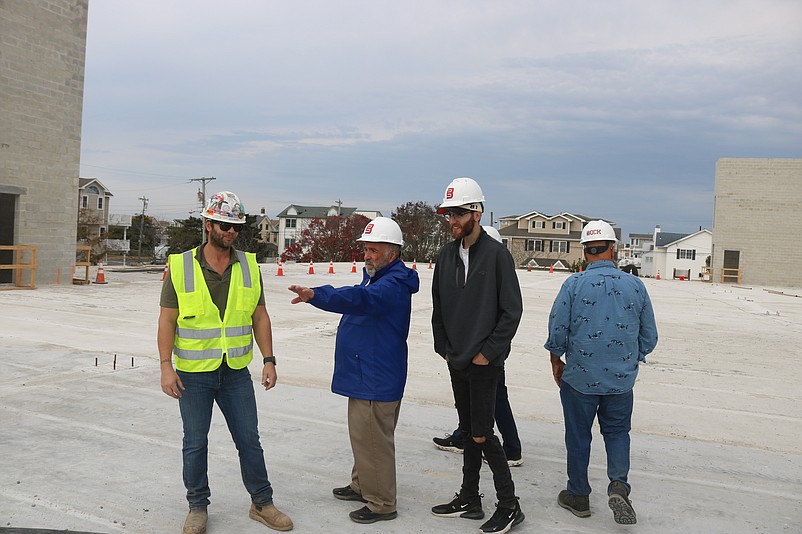 Mayor Leonard Desiderio, second from left, points to some of the features of the project during a tour of the construction site.