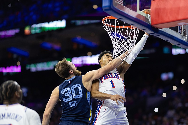 Nov 2, 2024; Philadelphia, Pennsylvania, USA; Philadelphia 76ers forward KJ Martin (1) is fouled by Memphis Grizzlies center Jay Huff (30) while driving for a shot during the second quarter at Wells Fargo Center. Mandatory Credit: Bill Streicher-Imagn Images