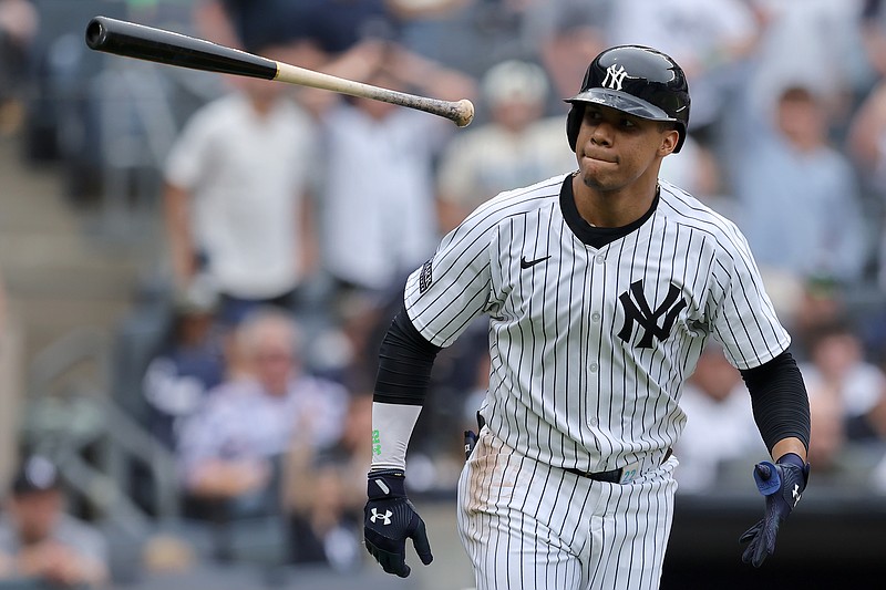 May 18, 2024; Bronx, New York, USA; New York Yankees right fielder Juan Soto (22) flips his bat after hitting a solo home run against the Chicago White Sox during the fifth inning at Yankee Stadium. Mandatory Credit: Brad Penner-USA TODAY Sports