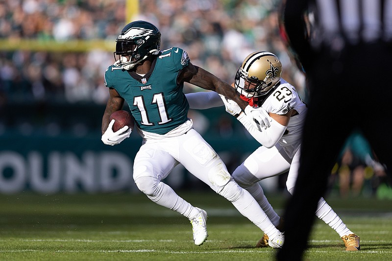 Jan 1, 2023; Philadelphia, Pennsylvania, USA; Philadelphia Eagles wide receiver A.J. Brown (11) makes a catch past New Orleans Saints cornerback Marshon Lattimore (23) during the second quarter at Lincoln Financial Field. Mandatory Credit: Bill Streicher-USA TODAY Sports