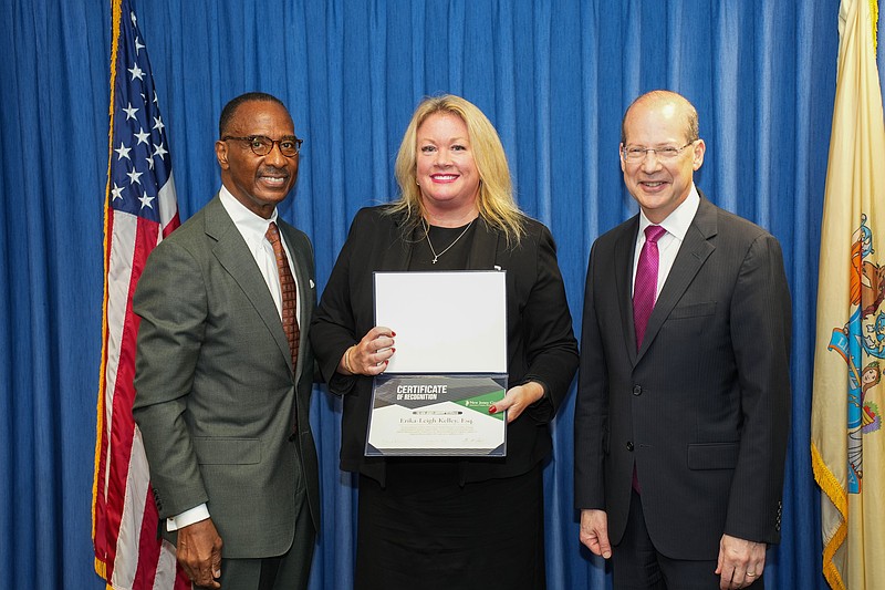 From left, Glenn Grant, administrative director of the Courts, Erika-Leigh Kelley, Esq. and Chief Justice Stuart Rabner.