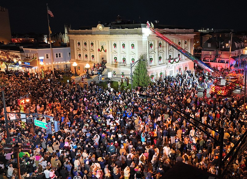 Santa Claus appears on the roof of City Hall to entertain the crowds at the downtown Christmas celebration. (Photo courtesy of Ocean City)