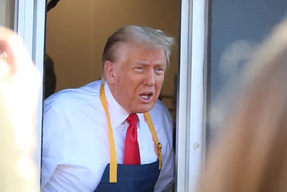 Former President Donald Trump speaking to reporters from the drive-thru window of a McDonald’s in Lower Southampton Township. (Credit: Tom Sofield/LevittownNow.com)