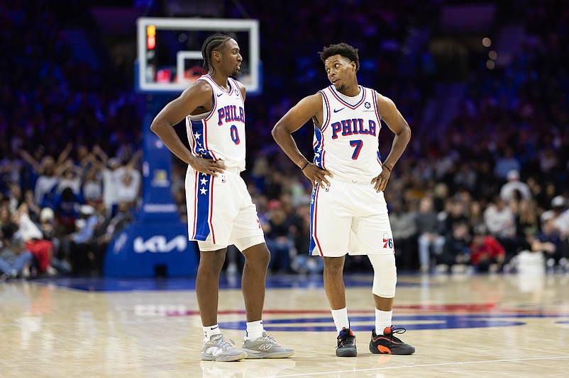 Nov 2, 2024; Philadelphia, Pennsylvania, USA; Philadelphia 76ers guard Tyrese Maxey (0) talks with guard Kyle Lowry (7) during the third quarter against the Memphis Grizzlies at Wells Fargo Center. Mandatory Credit: Bill Streicher-Imagn Images