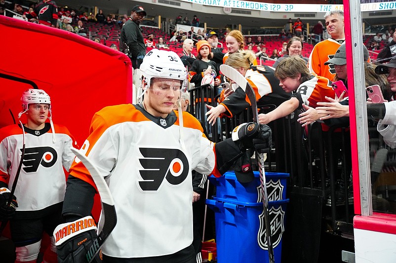 Nov 5, 2024; Raleigh, North Carolina, USA;  Philadelphia Flyers right wing Matvei Michkov (39)goes past the fans for the warmups against the Carolina Hurricanes at Lenovo Center. Mandatory Credit: James Guillory-Imagn Images