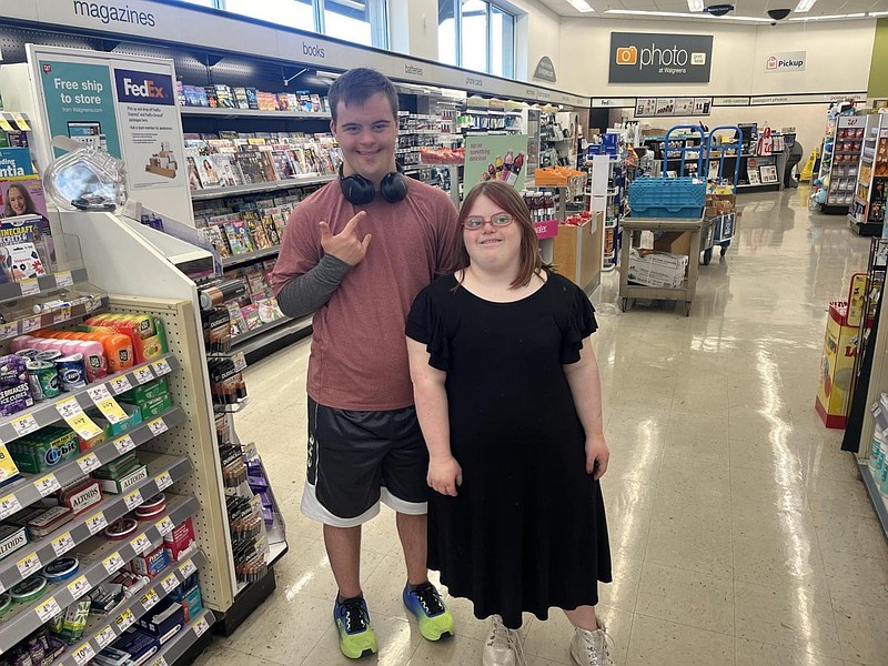 Post-12 members Jimmy Shea and Izzy Izzy Maggi working together at Walgreens  (Credit: Tyler Agriss)