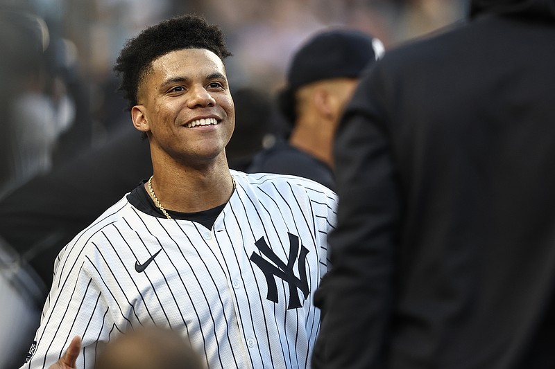 Aug 21, 2024; Bronx, New York, USA;  New York Yankees right fielder Juan Soto (22) celebrates in the dugout after hitting a two run home run in the first inning against the Cleveland Guardians at Yankee Stadium. Mandatory Credit: Wendell Cruz-USA TODAY Sports