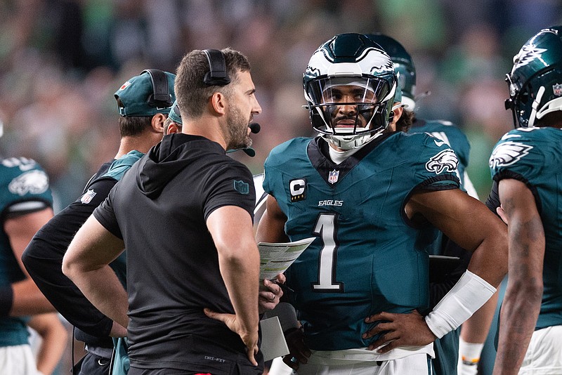 Sep 16, 2024; Philadelphia, Pennsylvania, USA; Philadelphia Eagles quarterback Jalen Hurts (1) talks with head coach Nick Sirianni during a timeout in the first quarter against the Atlanta Falcons at Lincoln Financial Field. Mandatory Credit: Bill Streicher-Imagn Images