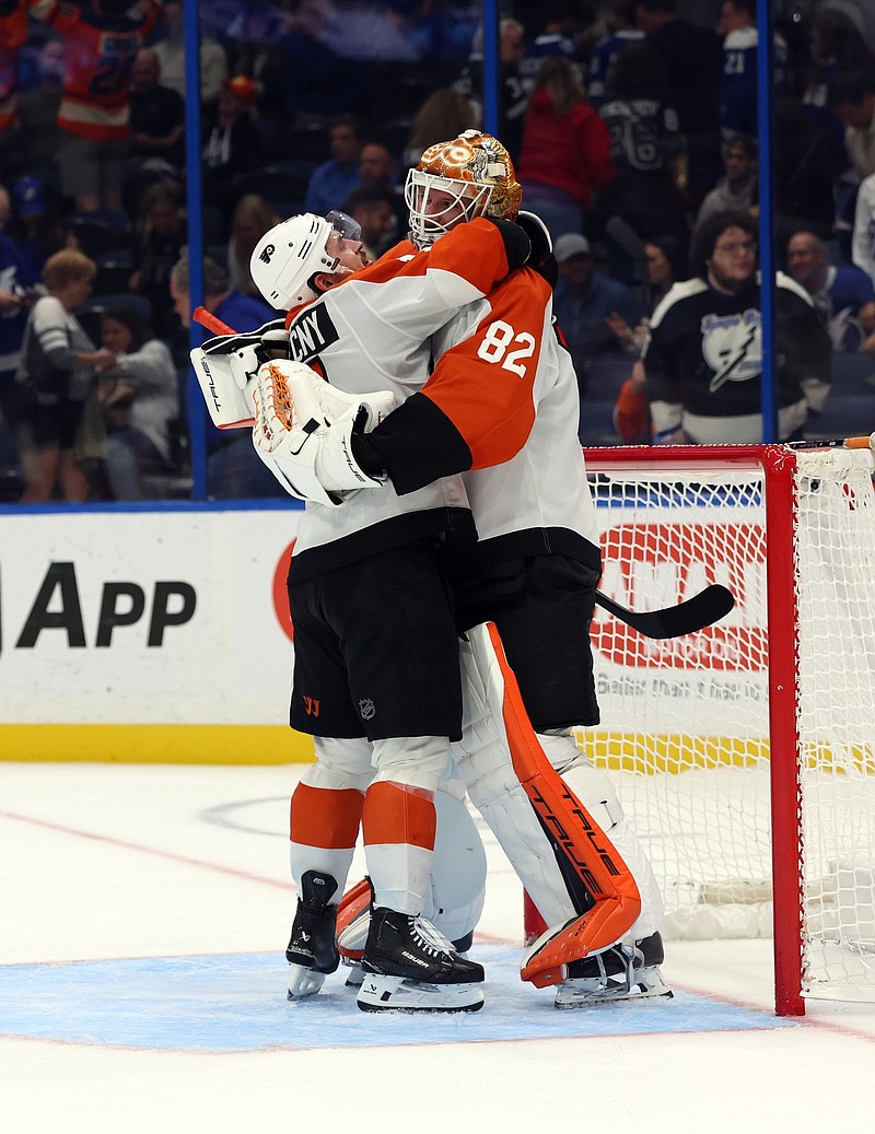 Nov 7, 2024; Tampa, Florida, USA; Philadelphia Flyers right wing Travis Konecny (11) and goaltender Ivan Fedotov (82) celebrate after defeating the Tampa Bay Lightning at Amalie Arena. Mandatory Credit: Kim Klement Neitzel-Imagn Images