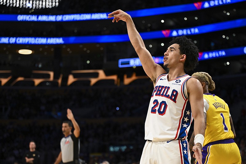 Nov 8, 2024; Los Angeles, California, USA; Philadelphia 76ers guard Jared McCain (20) shoots a three point basket against the Los Angeles Lakers during the first half at Crypto.com Arena. Mandatory Credit: Jonathan Hui-Imagn Images