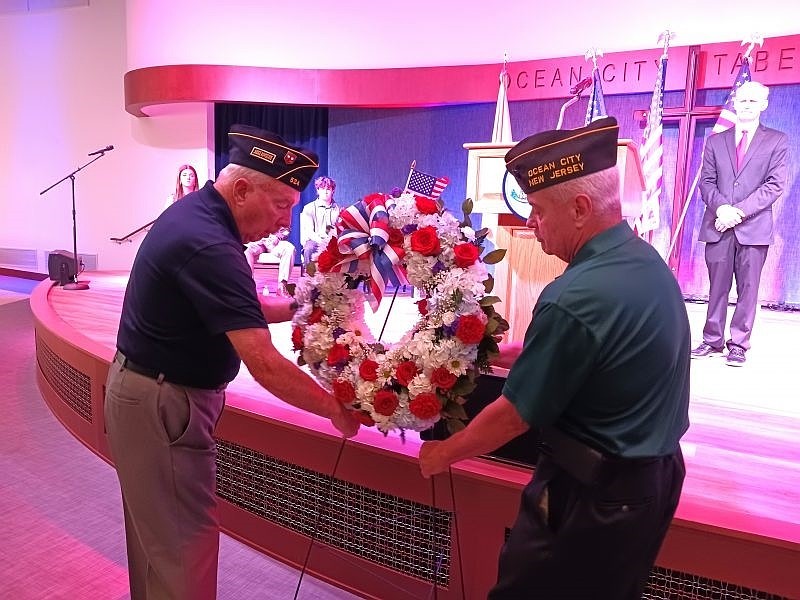 The laying of the ceremonial wreath is performed at the 2023 Veterans Day ceremony by American Legion Post 524 veteran Fred Distel, left, and VFW Post 6650 veteran Clark Manley.