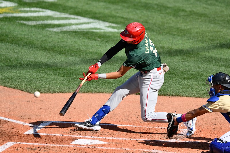 Jul 8, 2023; Seattle, Washington, USA; National League Futures designated hitter Justin Crawford (13) of the Philadelphia Phillies hits an RBI sacrifice fly against the American League during the second inning of the All Star-Futures game at T-Mobile Park. Mandatory Credit: Steven Bisig-USA TODAY Sports