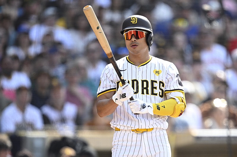 Jul 10, 2024; San Diego, California, USA; San Diego Padres shortstop Ha-Seong Kim (7) bats during the second inning against the Seattle Mariners at Petco Park. Mandatory Credit: Orlando Ramirez-USA TODAY Sports