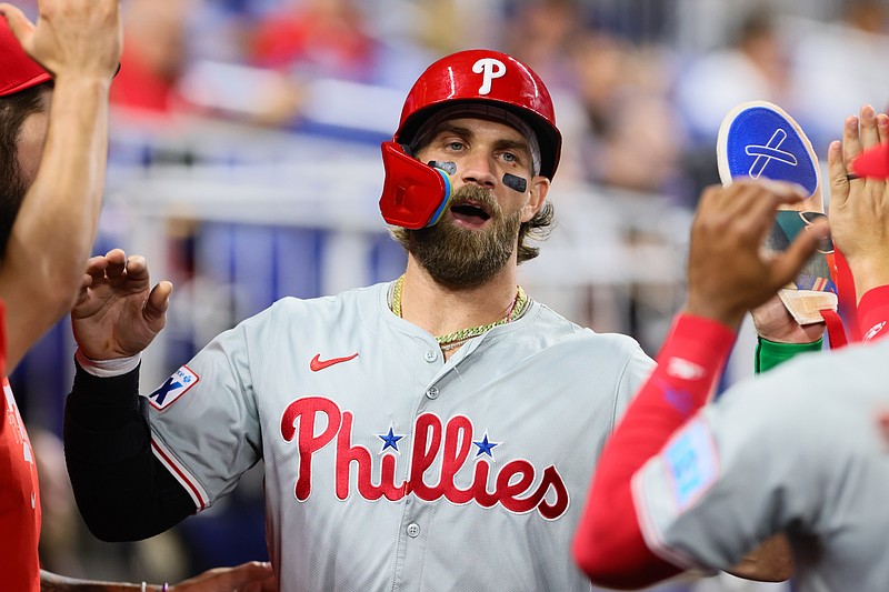 Sep 6, 2024; Miami, Florida, USA; Philadelphia Phillies first baseman Bryce Harper (3) celebrates after scoring against the Miami Marlins during the first inning at loanDepot Park. Mandatory Credit: Sam Navarro-Imagn Images