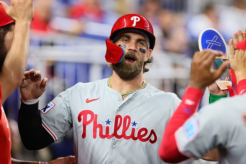 Sep 6, 2024; Miami, Florida, USA; Philadelphia Phillies first baseman Bryce Harper (3) celebrates after scoring against the Miami Marlins during the first inning at loanDepot Park. Mandatory Credit: Sam Navarro-Imagn Images