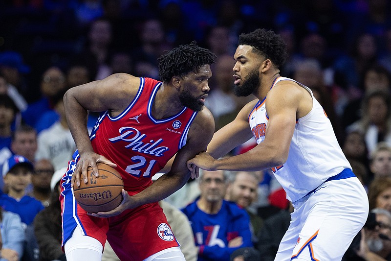 Nov 12, 2024; Philadelphia, Pennsylvania, USA; Philadelphia 76ers center Joel Embiid (21) controls the ball against New York Knicks center Karl-Anthony Towns (32) during the first quarter at Wells Fargo Center. Mandatory Credit: Bill Streicher-Imagn Images