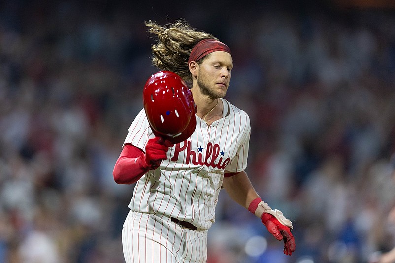 Jul 30, 2024; Philadelphia, Pennsylvania, USA; Philadelphia Phillies third base Alec Bohm (28) throws his helmet after lining out to end the eleventh inning against the New York Yankees at Citizens Bank Park. Mandatory Credit: Bill Streicher-USA TODAY Sports