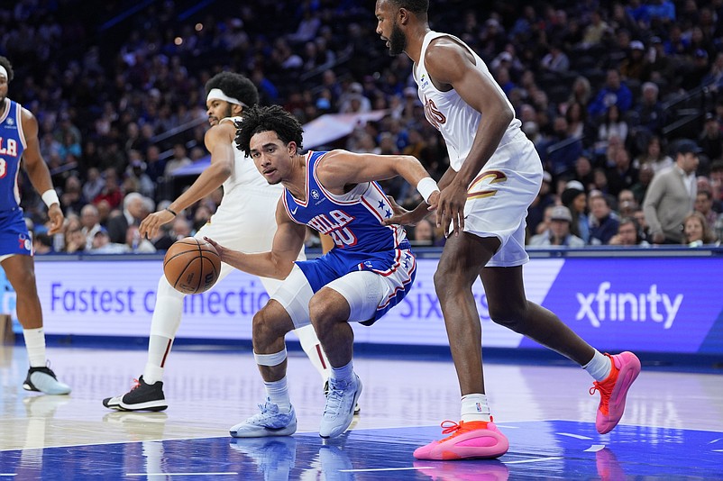 Nov 13, 2024; Philadelphia, Pennsylvania, USA; Philadelphia 76ers guard Jared McCain (20) drives against Cleveland Cavaliers center Evan Mobley (4) in the first quarter at Wells Fargo Center. Mandatory Credit: Kyle Ross-Imagn Images