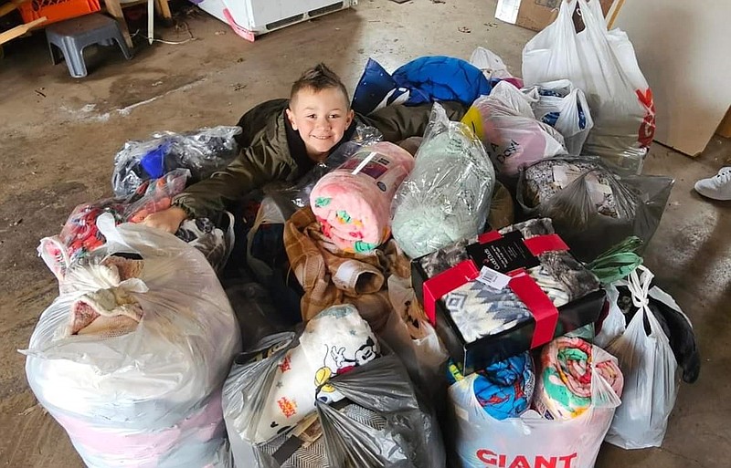 Trystin McGuire, of Hatfield, with his donations from last year. (Credit: Janel Conrad)