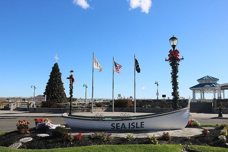 The Sea Isle City lifeboat next to the Promenade is surrounded by holiday decorations.