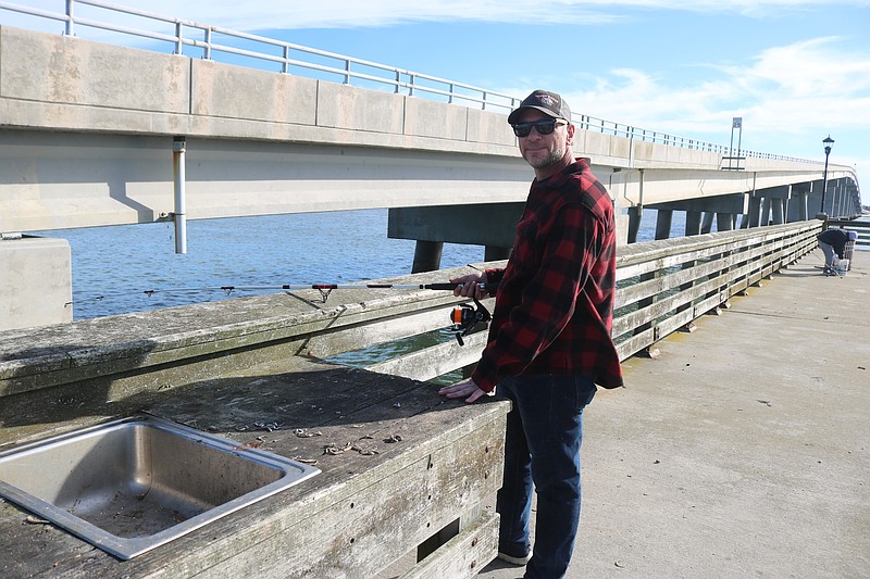 Ryan Willauer casts his line into the Great Egg Harbor Inlet from the fishing pier.