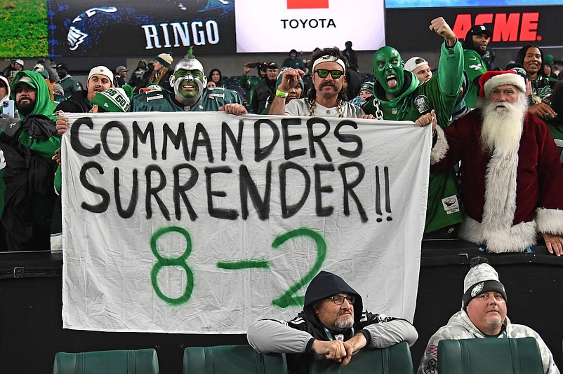 Nov 14, 2024; Philadelphia, Pennsylvania, USA; Philadelphia Eagles fans hold up a sign after win against the Washington Commanders at Lincoln Financial Field. Mandatory Credit: Eric Hartline-Imagn Images