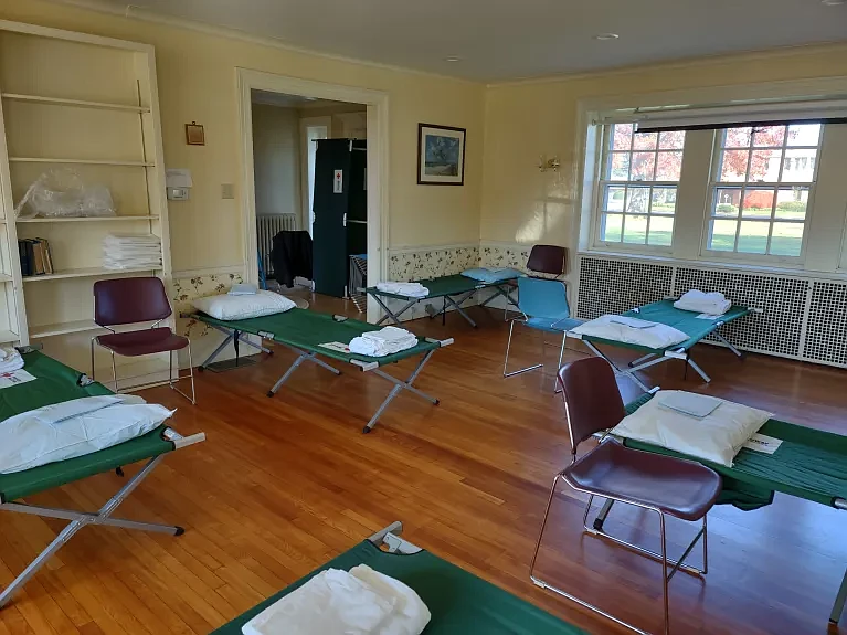 Cots stand inside a room at Trinity Lutheran Church’s Luther Hall, awaiting men in need of a place to stay during Code Blue nights. (Photo courtesy of Mark Lanan)