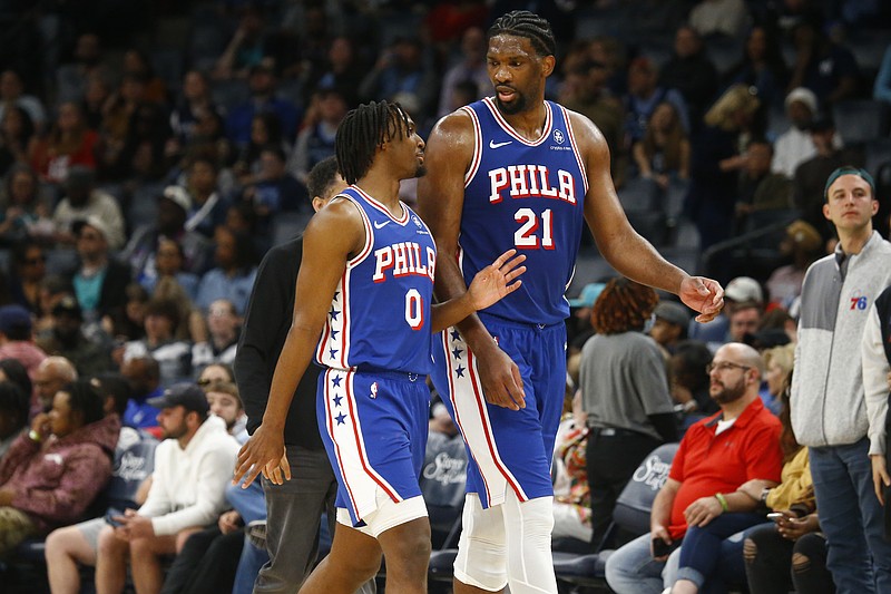 Apr 6, 2024; Memphis, Tennessee, USA; Philadelphia 76ers guard Tyrese Maxey (0) and center Joel Embiid (21) talk as they walk off the court at half time against the Memphis Grizzlies at FedExForum. Mandatory Credit: Petre Thomas-USA TODAY Sports