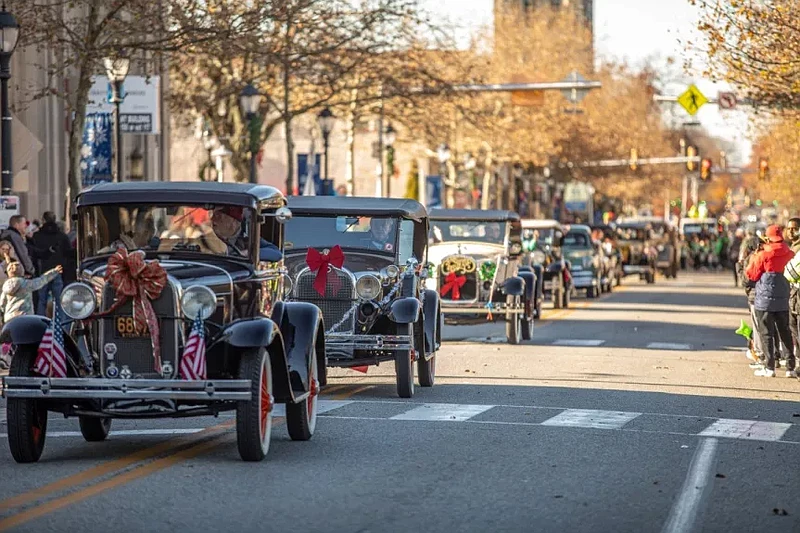 Classic cars sported holiday ribbons and decorations as they drove down Main Street during the Lansdale Mardi Gras Parade on Saturday, Nov. 18 2023.