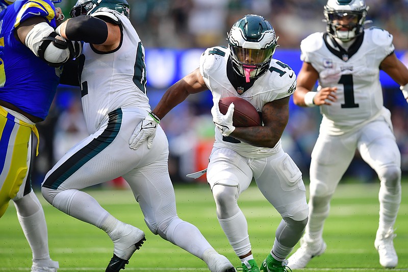 Oct 8, 2023; Inglewood, California, USA; Philadelphia Eagles running back Kenneth Gainwell (14) runs the ball against the Los Angeles Rams during the second half at SoFi Stadium. Mandatory Credit: Gary A. Vasquez-USA TODAY Sports