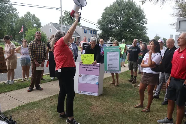 Stephanie Barnett Jamison, president of Souderton Area for All, reads some of school director Bill Formica’s objectionable social media posts.