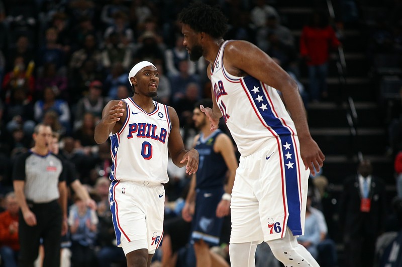 Nov 20, 2024; Memphis, Tennessee, USA; Philadelphia 76ers guard Tyrese Maxey (0) and center Joel Embiid (21) react during the second half against the Memphis Grizzlies at FedExForum. Mandatory Credit: Petre Thomas-Imagn Images