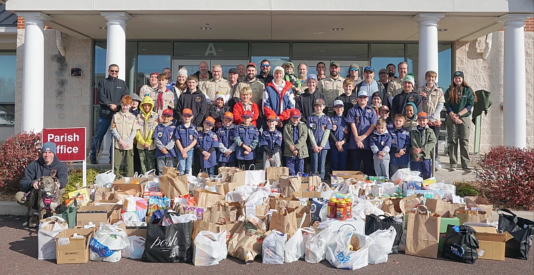 Scouts and Cub Pack 303 from Corpus Christi Parish with food collected for the Patrician Society Nov. 16, 2024. (Photo courtesy Stanley Jaskiewicz)