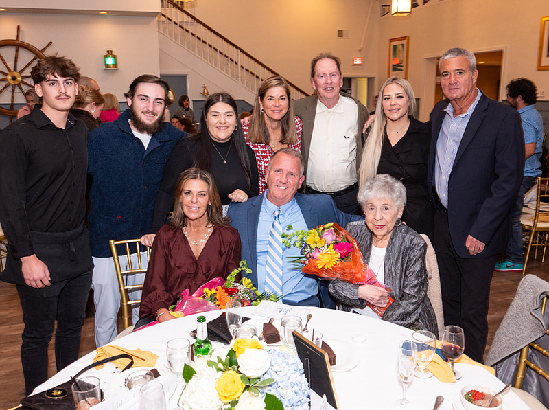 Citizen of the Year Bill McGinnity, seated in center, is joined by his family members at the Chamber of Commerce awards dinner. (Photos courtesy of Ocean City Regional Chamber of Commerce)