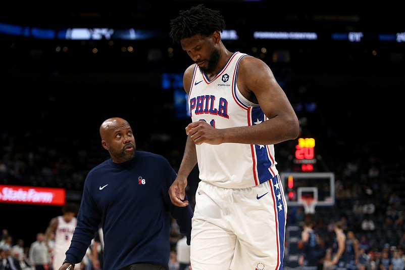 Nov 20, 2024; Memphis, Tennessee, USA; Philadelphia 76ers center Joel Embiid (21) limps to the bench during a time out during the second half against the Memphis Grizzlies at FedExForum. Mandatory Credit: Petre Thomas-Imagn Images