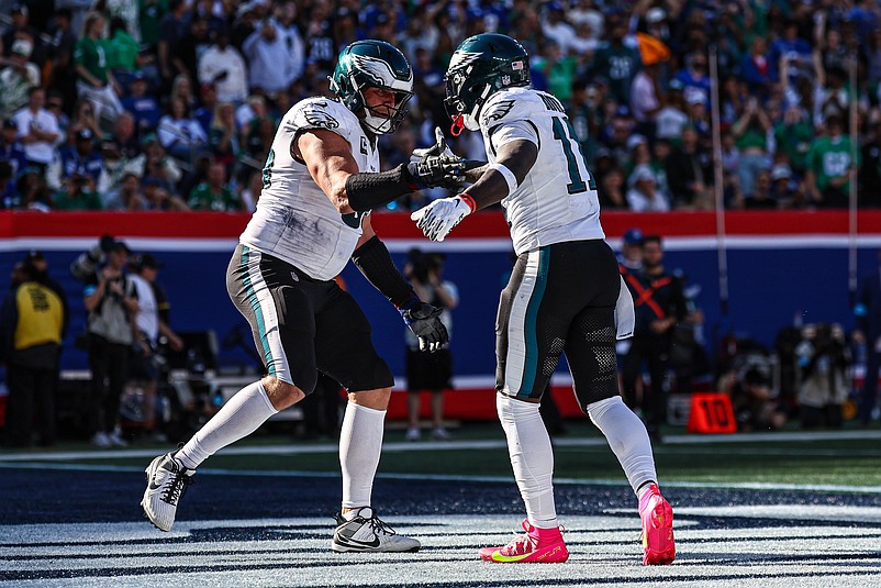 Oct 20, 2024; East Rutherford, New Jersey, USA; Philadelphia Eagles wide receiver A.J. Brown (11) and offensive tackle Jordan Mailata (68) celebrates after an Eagles touchdown during the second half against the New York Giants at MetLife Stadium. Mandatory Credit: Vincent Carchietta-Imagn Images