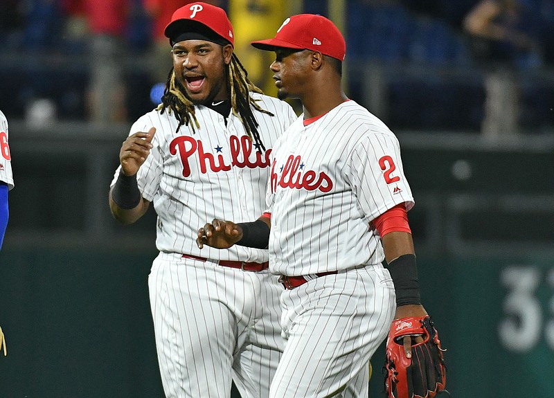 Jun 25, 2019; Philadelphia, PA, USA; Philadelphia Phillies third baseman Maikel Franco (7) celebrates the win with shortstop Jean Segura (2) against the New York Mets at Citizens Bank Park. Mandatory Credit: Eric Hartline-USA TODAY Sports