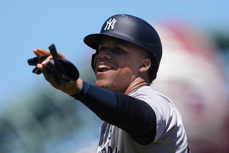 Jun 2, 2024; San Francisco, California, USA; New York Yankees right fielder Juan Soto (22) gestures after a bunt single against the San Francisco Giants during the fifth inning at Oracle Park. Mandatory Credit: Darren Yamashita-USA TODAY Sports