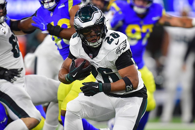 Nov 24, 2024; Inglewood, California, USA; Philadelphia Eagles running back Saquon Barkley (26) runs the ball against the Los Angeles Rams during the first half at SoFi Stadium. Mandatory Credit: Gary A. Vasquez-Imagn Images